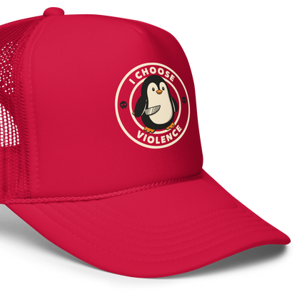 A cute cartoon penguin holding a knife stands in the center of a circular emblem. Surrounding the penguin are the words 'I CHOOSE VIOLENCE' with two small skull icons on both sides. The design is playful yet ironic, blending adorableness with a hint of dark humor.