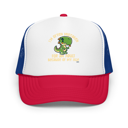 Cute cartoon dinosaur standing with a funny expression, accompanied by the humorous phrase “I’m Often Mistaken for an Adult Because of My Age” in bold distressed lettering.