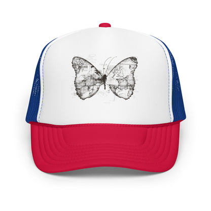 The image features a black and white butterfly where the wings are created using ancient world map designs. The maps overlay in intricate detail, blending geographical elements with the organic shape of the butterfly. Surrounding the butterfly are faint outlines of text and additional geographic features, creating a vintage and exploratory vibe.