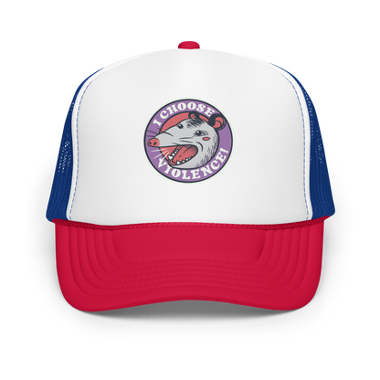 A circular design featuring an opossum with an open mouth showing sharp teeth, set against a red and purple background. Surrounding the animal, the text reads 'I Choose Violence!' in bold, white letters. The opossum has a somewhat comical yet aggressive expression. The design has an edgy, cartoon-like style, suitable for various products like t-shirts and stickers.