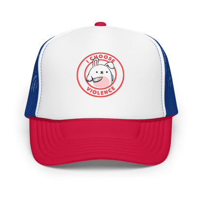 A cute white cartoon bunny with a pink belly stands holding a large kitchen knife in one paw. Surrounding the bunny is a red circular border with the words 'I CHOOSE VIOLENCE'. Small skull icons are on either side of the circle. The overall tone is a mix of adorable and ironic humor.