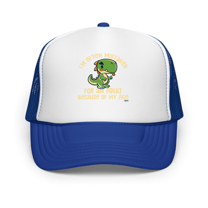 Cute cartoon dinosaur standing with a funny expression, accompanied by the humorous phrase “I’m Often Mistaken for an Adult Because of My Age” in bold distressed lettering.