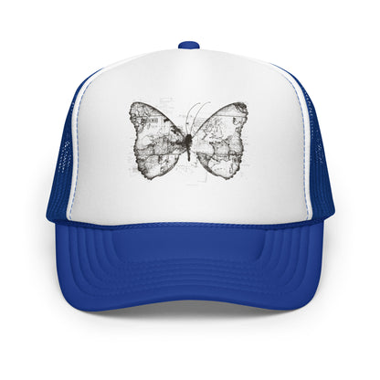 The image features a black and white butterfly where the wings are created using ancient world map designs. The maps overlay in intricate detail, blending geographical elements with the organic shape of the butterfly. Surrounding the butterfly are faint outlines of text and additional geographic features, creating a vintage and exploratory vibe.