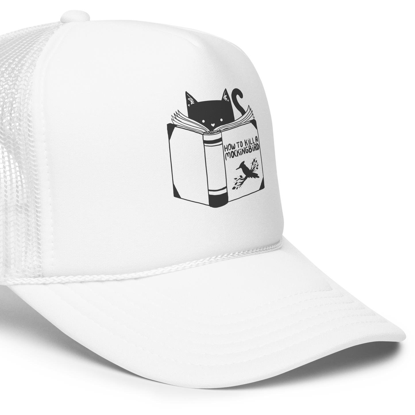 A black and white illustration features a cat peeking over an open book titled 'How to Kill a Mockingbird,' playfully altering the classic novel's title. The cat has a heart-shaped nose and simple, cute facial features. The design is whimsical and ironic, combining classic literature with a humorous twist.