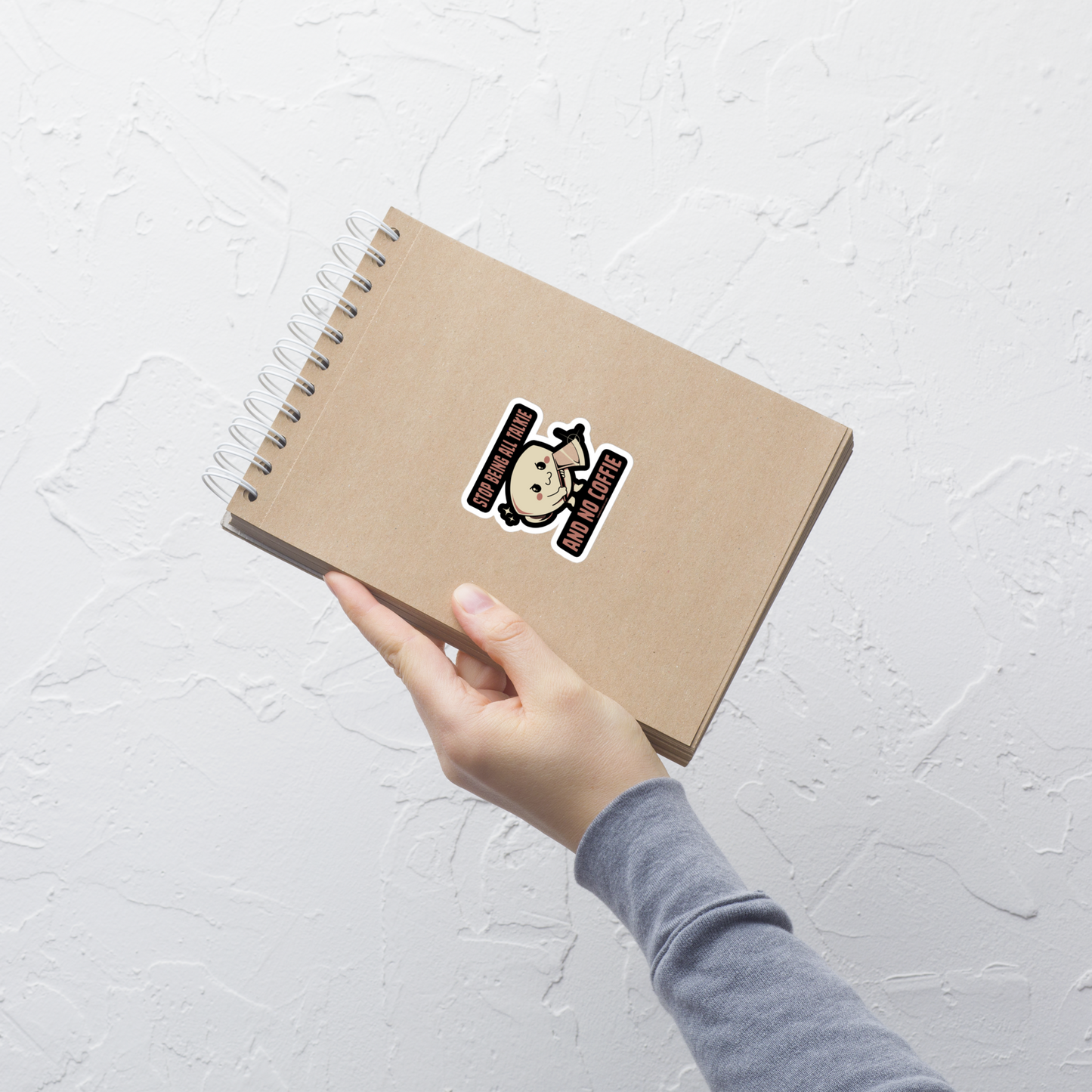 A charming coffee cup holding an axe alongside the phrase “All Talkie And No Coffie”. This playful yet edgy design captures the contrast between sweet morning vibes and the unstoppable force of caffeine. Perfect for coffee lovers who wake up cute… but powered by attitude.