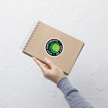 A green frog with a determined look stands beside the playful phrase “Stay Hoptimistic — Or Else”. A fun pun with a slightly chaotic twist, perfect for frog lovers and anyone who enjoys quirky, attitude-filled humor.