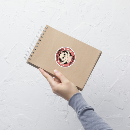 A stamp-style illustration of a cute kitten giving a two-finger thumbs-up, paired with the humorous phrase “Make America Cat Again”. A fun, ironic design for cat lovers and fans of playful pop culture art.