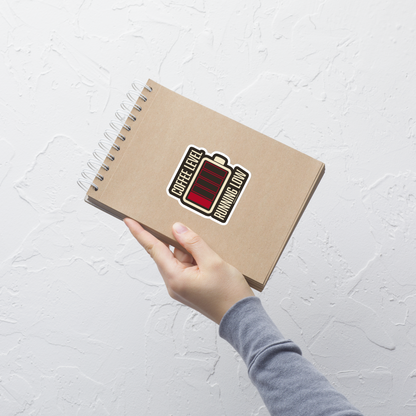 A minimalist artwork featuring a nearly empty battery indicator paired with the phrase ‘Coffee Level Running Low.’ A witty and relatable design for coffee lovers, caffeine addicts, office workers, students, and anyone who runs on coffee to get through the day.