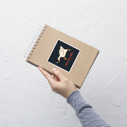 A white goose gripping a sharp knife in its beak with the phrase “Duck, Duck, Goose” below. A playful twist on the classic game, this design captures chaotic goose energy with a sharp dose of dark humor.