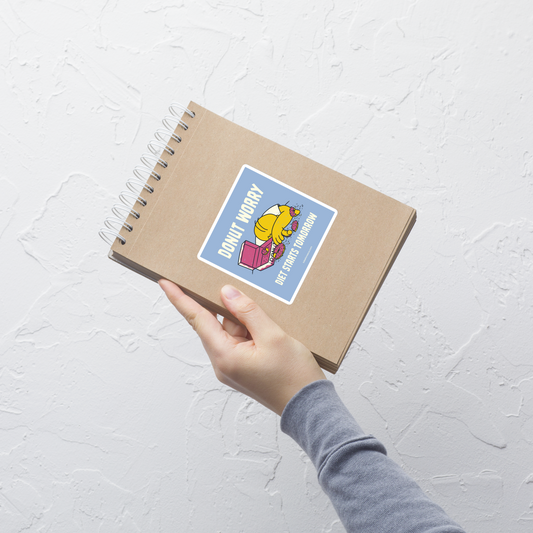 A playful design featuring a sleepy yellow cartoon character next to an open box of donuts, surrounded by crumbs and icing, with the phrase “Donut Worry Diet Starts Tomorrow”. Sweet, relatable and full of humor, it’s the perfect gift for donut lovers and anyone who believes diets can always start tomorrow.