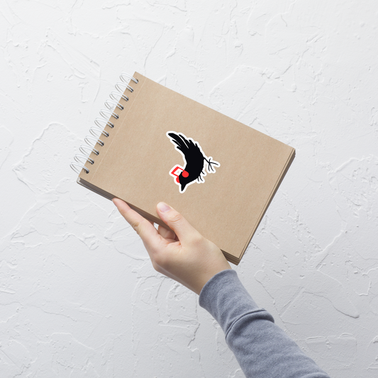 The drawing is a black silhouette of a bird in profile, standing on the ground, with bright red musical notes positioned like headphones over its ears, creating a whimsical and playful contrast. The drawing is simple, using solid colors and minimal details, giving it a modern and fun feel suitable for various merchandise like t-shirts, stickers, coffee cups, and skateboards.