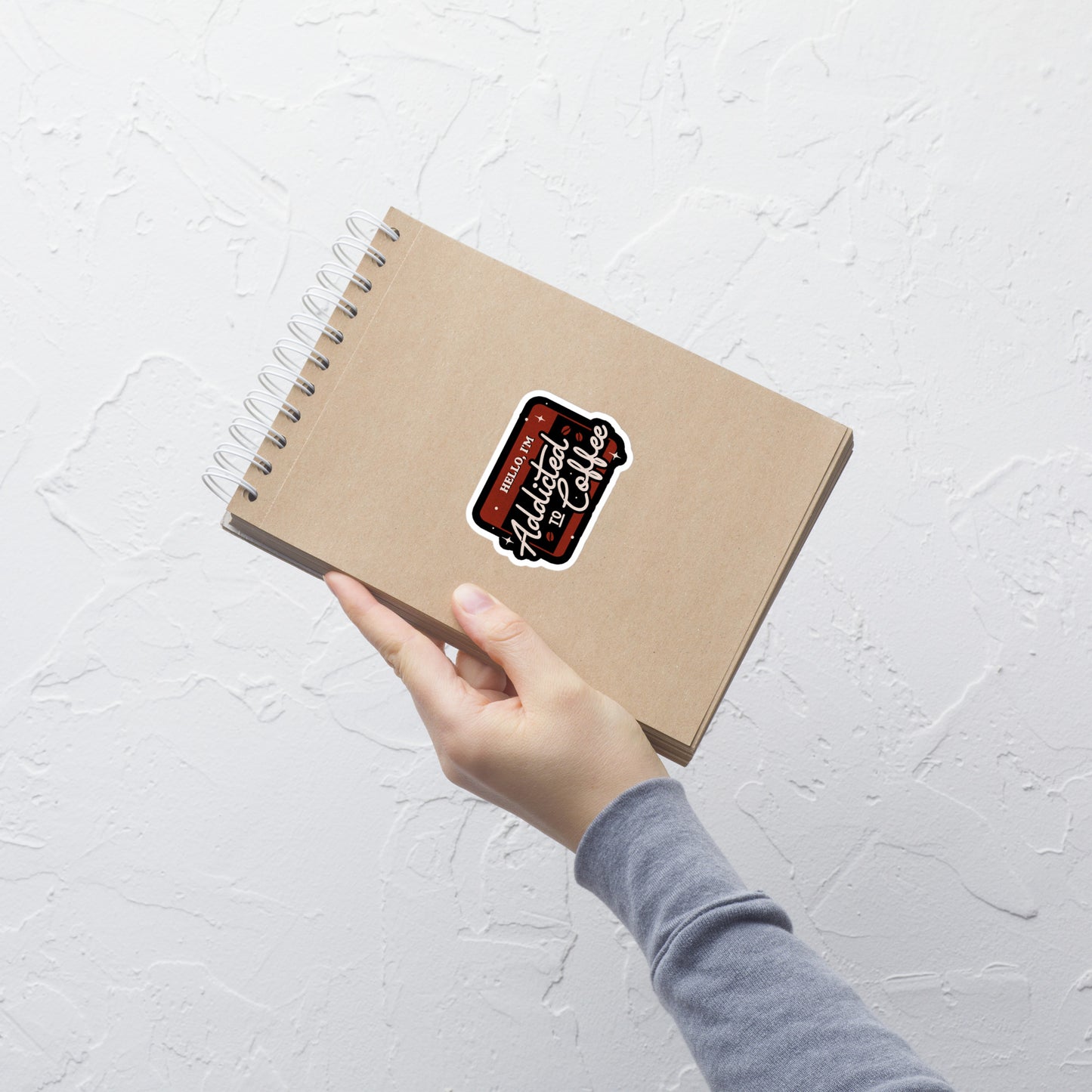 A vintage badge in shades of red with the phrase "Hello, I'm Addicted to 
Coffee" in stylized typography. This design celebrates the passion for coffee 
with a touch of humor. Perfect for coffee lovers, baristas, and everyone who only functions after the first cup.
