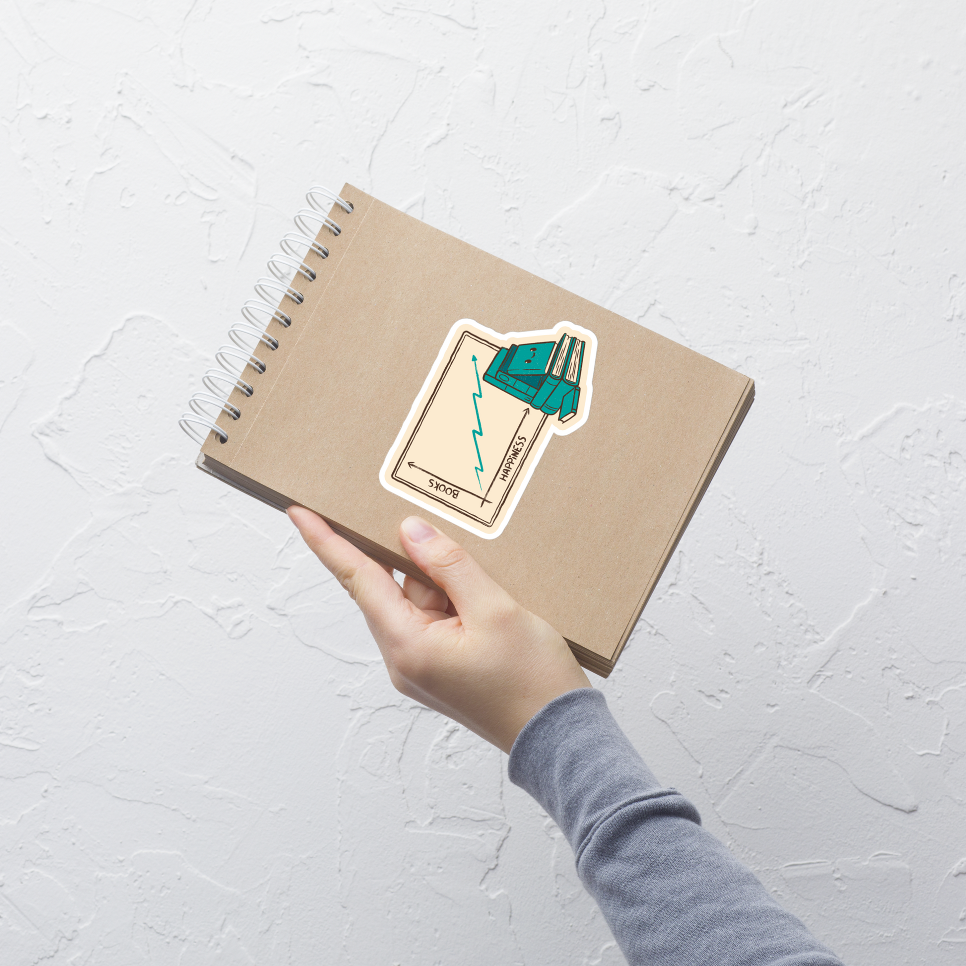 A graphic where happiness increases as the stack of books grows, accompanied by a cute little book with a friendly face. This design plays with the idea that reading is a direct fuel for well-being, mixing humor, cuteness, and a nerdy touch. Perfect for passionate readers, students, teachers, and anyone who finds joy in the pages of a good book.