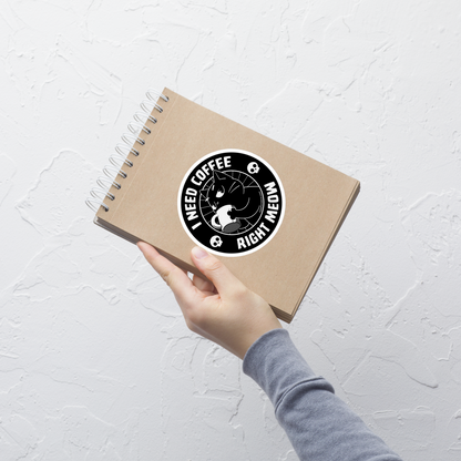 A black cat enjoying a hot cup of coffee, paired with the phrase ‘I Need Coffee Right Meow’. This playful design blends feline charm with caffeine-fuelled attitude, perfect for cat lovers who can’t function without their morning brew. Cute, relatable and full of purr-sonality.