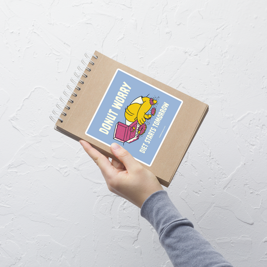 A playful design featuring a sleepy yellow cartoon character next to an open box of donuts, surrounded by crumbs and icing, with the phrase “Donut Worry Diet Starts Tomorrow”. Sweet, relatable and full of humor, it’s the perfect gift for donut lovers and anyone who believes diets can always start tomorrow.
