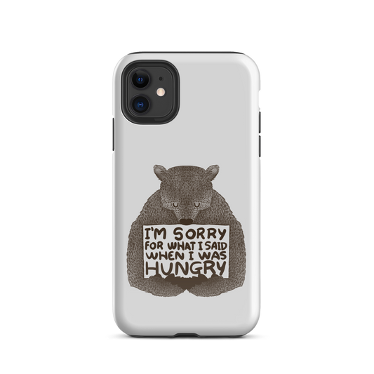 The image shows a humorous, detailed illustration of a bear, drawn in a hand-drawn style, holding a sign that reads 'I'm sorry for what I said when I was hungry.' The bear appears to be apologizing in a comical, endearing manner, making it a relatable and light-hearted design.
