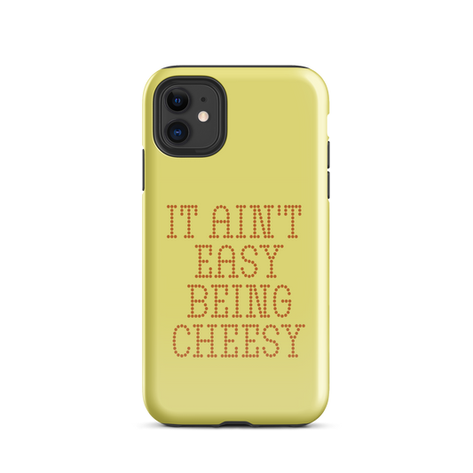 Bold dotted typography spells out ‘It Ain’t Easy Being Cheesy’ in a playful retro style on a yellow background. This funny design mixes wordplay with foodie humor, perfect for pun lovers, cheese fans, retro humor enthusiasts, and anyone who embraces the cringe with pride. A great quirky gift for cheese lovers and humor fans alike.