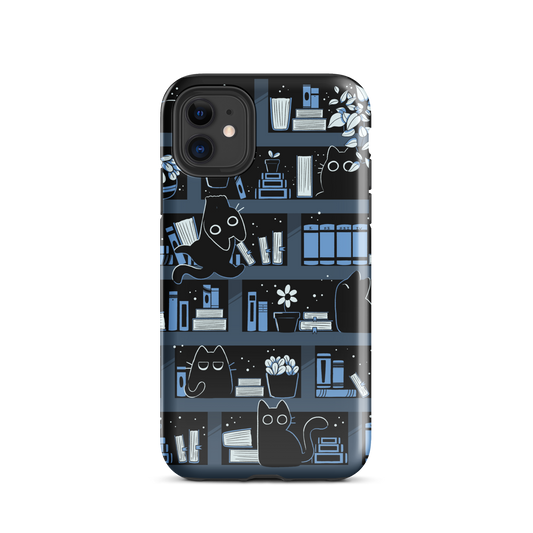 A pattern designed to resemble one large bookshelf filled with books, plants and playful little black kittens tucked between the shelves. An artwork in shades of black and blue, perfect for those who love cats, books and plants.