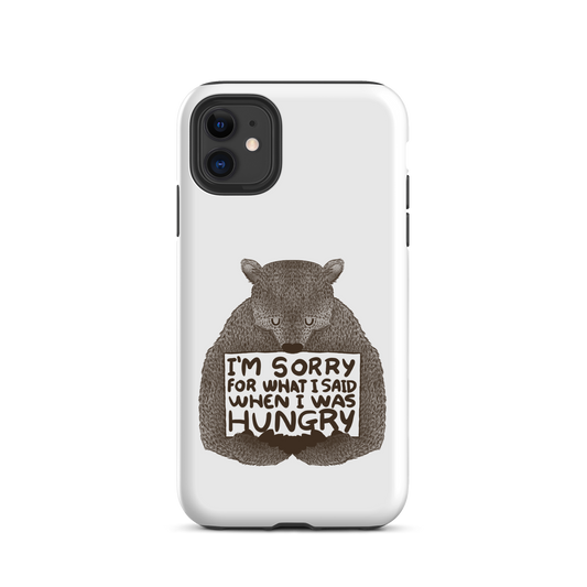 The image shows a humorous, detailed illustration of a bear, drawn in a hand-drawn style, holding a sign that reads 'I'm sorry for what I said when I was hungry.' The bear appears to be apologizing in a comical, endearing manner, making it a relatable and light-hearted design.