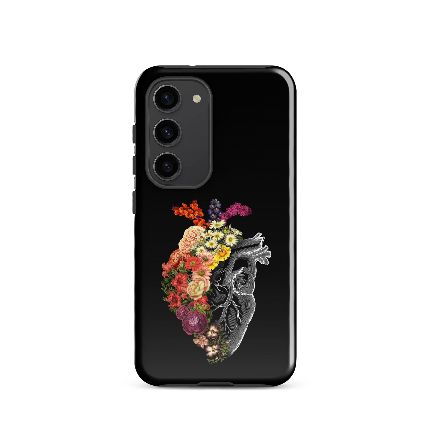 The design is an intricate and anatomical drawing of a human heart on a black background. The left side of the heart morphs into a vibrant assortment of colorful flowers, including roses, daisies, and other blooming blossoms, creating a striking contrast between the realistic and the surreal, symbolizing the harmony between nature and humanity.