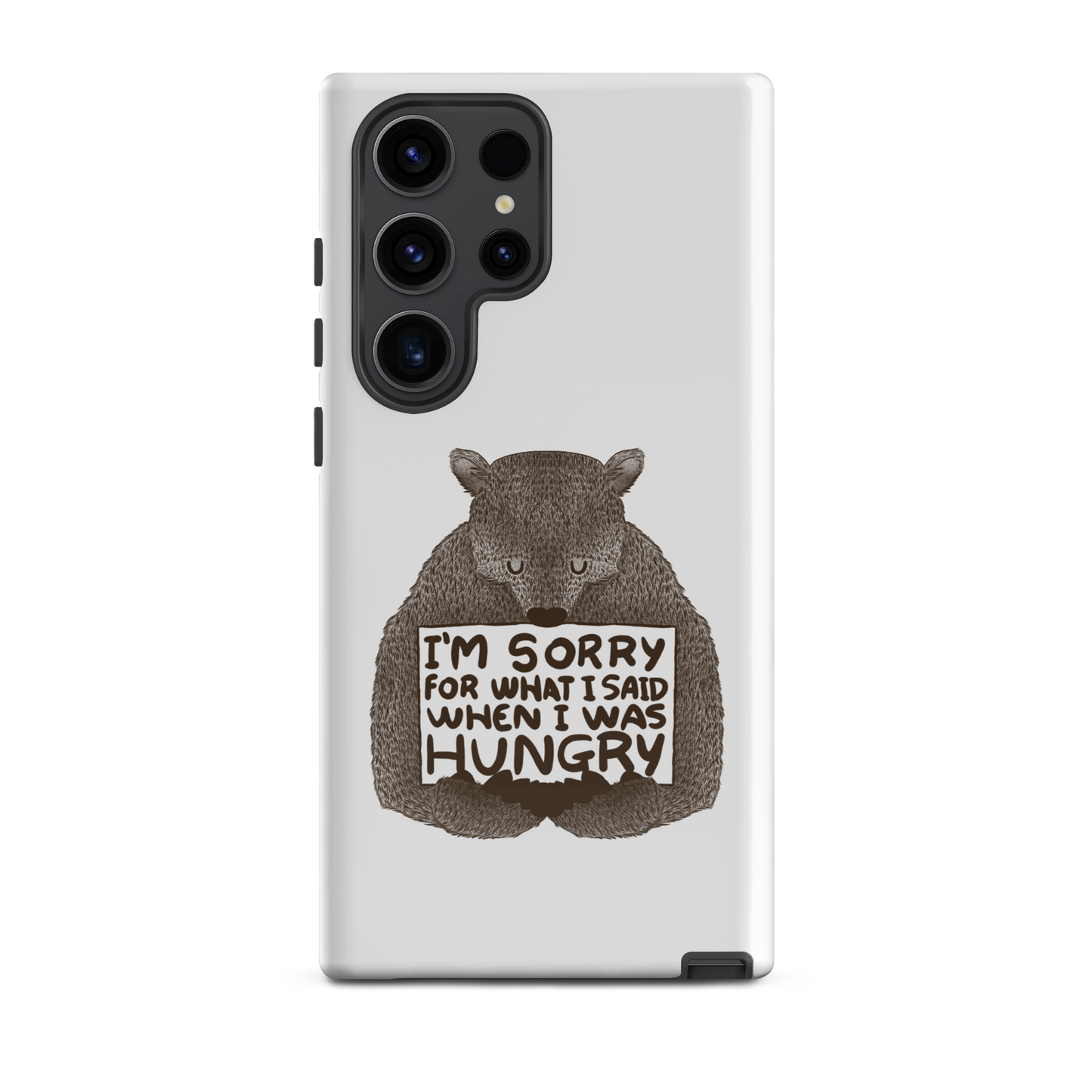 The image shows a humorous, detailed illustration of a bear, drawn in a hand-drawn style, holding a sign that reads 'I'm sorry for what I said when I was hungry.' The bear appears to be apologizing in a comical, endearing manner, making it a relatable and light-hearted design.