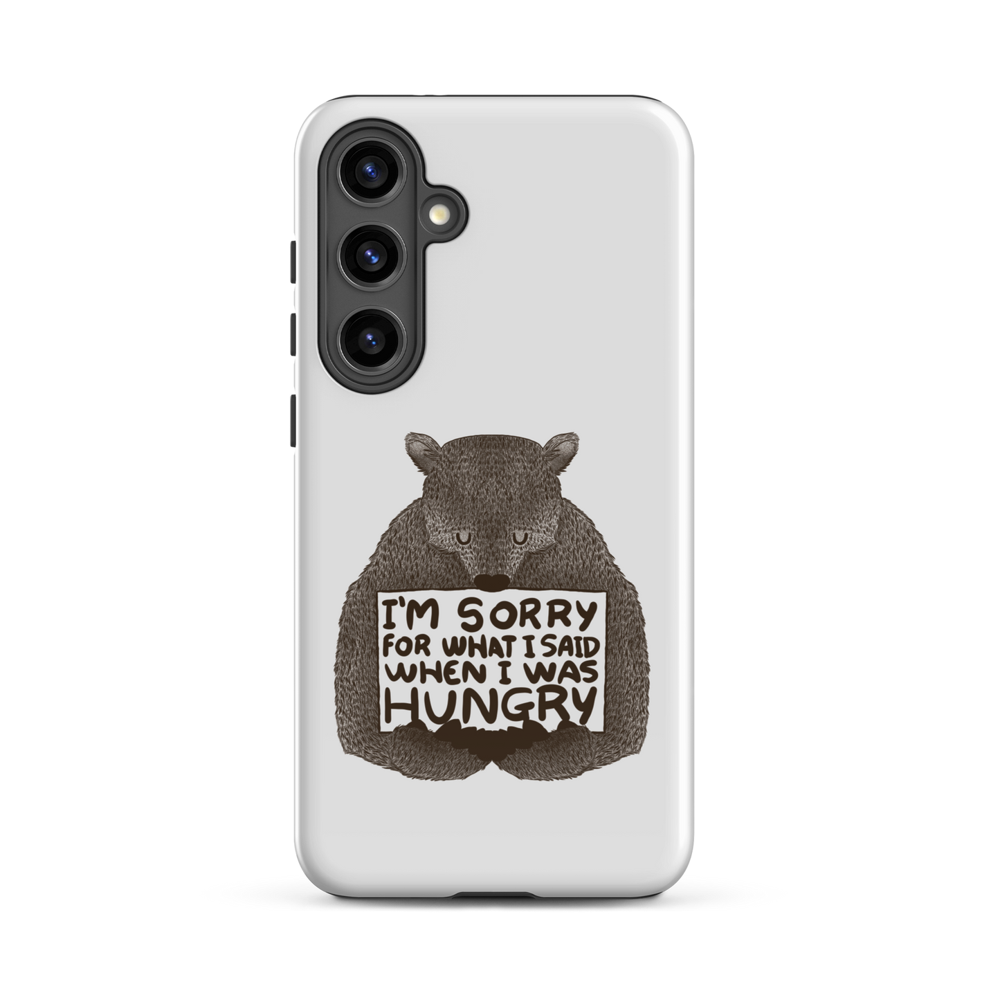 The image shows a humorous, detailed illustration of a bear, drawn in a hand-drawn style, holding a sign that reads 'I'm sorry for what I said when I was hungry.' The bear appears to be apologizing in a comical, endearing manner, making it a relatable and light-hearted design.