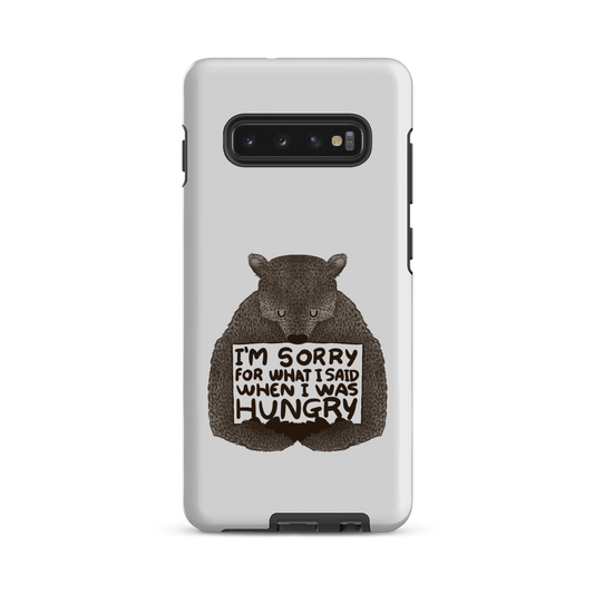 The image shows a humorous, detailed illustration of a bear, drawn in a hand-drawn style, holding a sign that reads 'I'm sorry for what I said when I was hungry.' The bear appears to be apologizing in a comical, endearing manner, making it a relatable and light-hearted design.