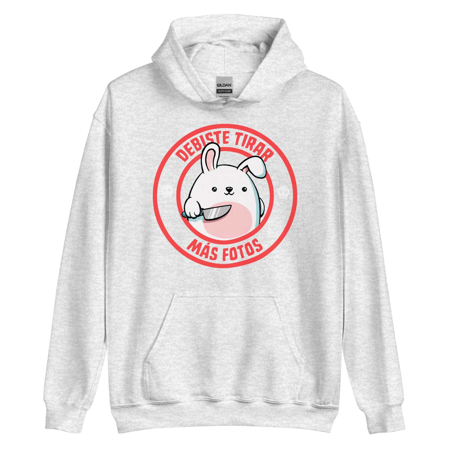 A cute white cartoon bunny with a pink belly stands holding a large kitchen knife in one paw. Surrounding the bunny is a red circular border with the words 'DEBISTE TIRAR MÁS FOTOS'. Small skull icons are on either side of the circle. The overall tone is a mix of adorable and ironic humor.