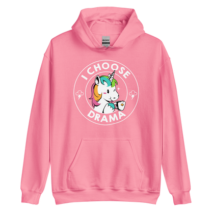 A cartoon unicorn with rainbow-colored mane holds a cup of tea and a heart, encircled by the words 'I Choose Drama'. Two small clouds with lightning bolts flank the unicorn, adding a playful yet slightly edgy vibe. The design is bold and whimsical with a pop-art influence.