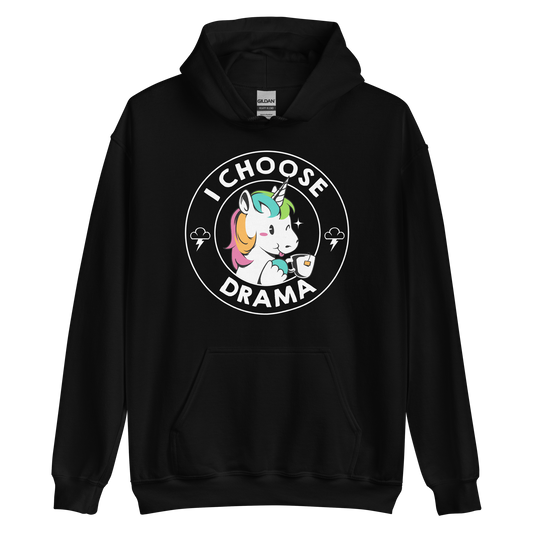 A cartoon unicorn with rainbow-colored mane holds a cup of tea and a heart, encircled by the words 'I Choose Drama'. Two small clouds with lightning bolts flank the unicorn, adding a playful yet slightly edgy vibe. The design is bold and whimsical with a pop-art influence.
