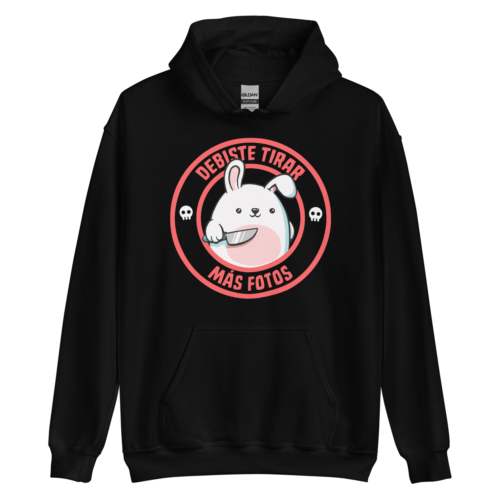 A cute white cartoon bunny with a pink belly stands holding a large kitchen knife in one paw. Surrounding the bunny is a red circular border with the words 'DEBISTE TIRAR MÁS FOTOS'. Small skull icons are on either side of the circle. The overall tone is a mix of adorable and ironic humor.