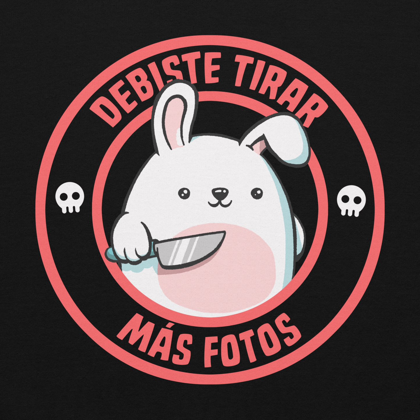 A cute white cartoon bunny with a pink belly stands holding a large kitchen knife in one paw. Surrounding the bunny is a red circular border with the words 'DEBISTE TIRAR MÁS FOTOS'. Small skull icons are on either side of the circle. The overall tone is a mix of adorable and ironic humor.