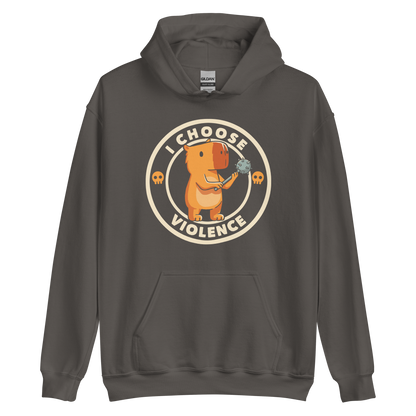 A cute, cartoonish burnt yellow capybara stands holding a spiked mace with a determined expression. Surrounding it is a circular design with the text 'I CHOOSE VIOLENCE' and two small skulls on either side, giving it a humorous yet ironic tone.