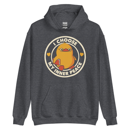 A cute yellow bird with a small tuft of feathers on its head is wearing round glasses and holding a red book. The bird has a determined expression. The image is encircled by the phrase 'I CHOOSE MY INNER PEACE' with two small hearts on each side.