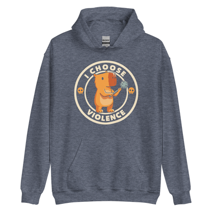 A cute, cartoonish burnt yellow capybara stands holding a spiked mace with a determined expression. Surrounding it is a circular design with the text 'I CHOOSE VIOLENCE' and two small skulls on either side, giving it a humorous yet ironic tone.