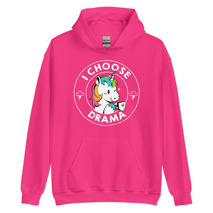 A cartoon unicorn with rainbow-colored mane holds a cup of tea and a heart, encircled by the words 'I Choose Drama'. Two small clouds with lightning bolts flank the unicorn, adding a playful yet slightly edgy vibe. The design is bold and whimsical with a pop-art influence.