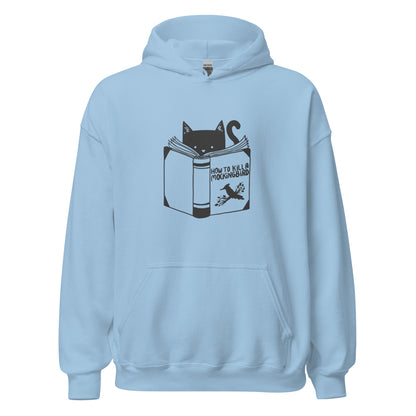 A black and white illustration features a cat peeking over an open book titled 'How to Kill a Mockingbird,' playfully altering the classic novel's title. The cat has a heart-shaped nose and simple, cute facial features. The design is whimsical and ironic, combining classic literature with a humorous twist.