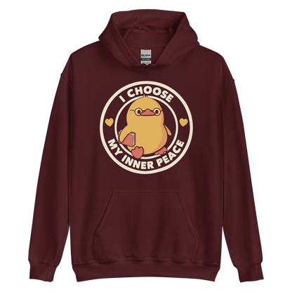 A cute yellow bird with a small tuft of feathers on its head is wearing round glasses and holding a red book. The bird has a determined expression. The image is encircled by the phrase 'I CHOOSE MY INNER PEACE' with two small hearts on each side.