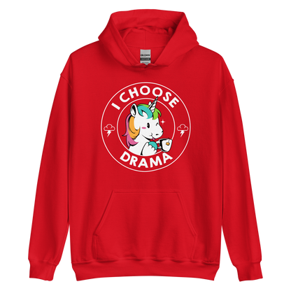 A cartoon unicorn with rainbow-colored mane holds a cup of tea and a heart, encircled by the words 'I Choose Drama'. Two small clouds with lightning bolts flank the unicorn, adding a playful yet slightly edgy vibe. The design is bold and whimsical with a pop-art influence.