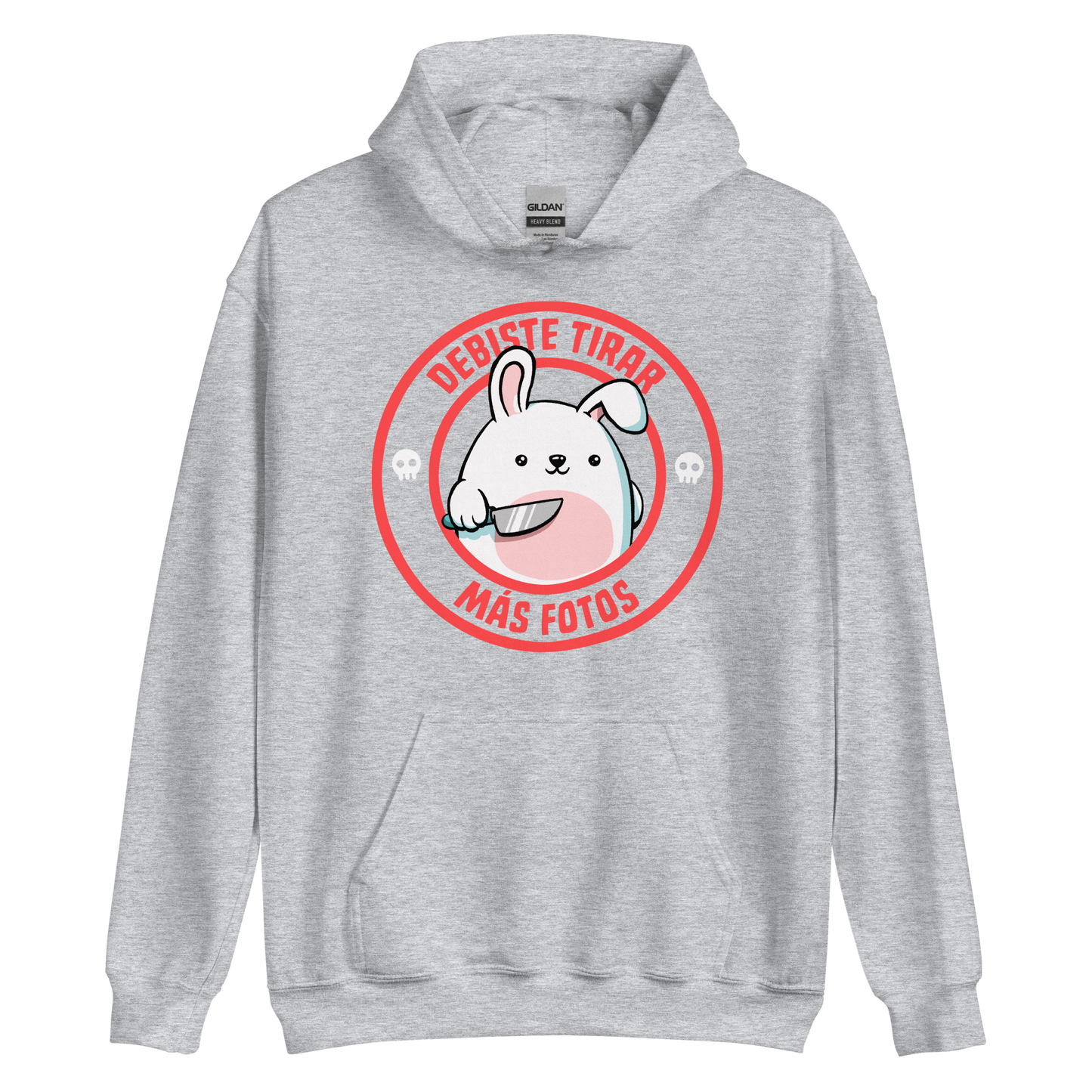 A cute white cartoon bunny with a pink belly stands holding a large kitchen knife in one paw. Surrounding the bunny is a red circular border with the words 'DEBISTE TIRAR MÁS FOTOS'. Small skull icons are on either side of the circle. The overall tone is a mix of adorable and ironic humor.