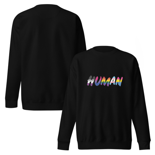 The image displays the word 'HUMAN' in bold, capitalized letters filled with colorful pride flag patterns. The colors within the letters represent different LGBTQ+ pride flags, symbolizing inclusivity and diversity. The background is solid black, which makes the colorful patterns stand out more vibrantly.