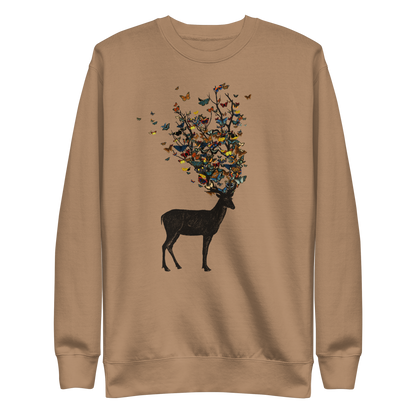 The image depicts a dark, silhouetted deer standing on a neutral background. Instead of branches, its antlers transform into a swirling cloud of vibrant, colorful butterflies that extend upwards and outward. The mix of organic and ethereal elements creates a captivating and whimsical visual contrast.