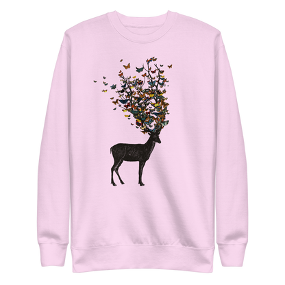 The image depicts a dark, silhouetted deer standing on a neutral background. Instead of branches, its antlers transform into a swirling cloud of vibrant, colorful butterflies that extend upwards and outward. The mix of organic and ethereal elements creates a captivating and whimsical visual contrast.