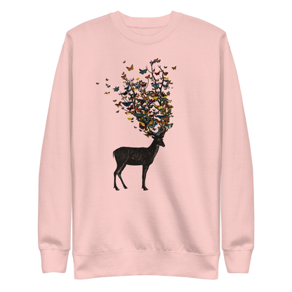 The image depicts a dark, silhouetted deer standing on a neutral background. Instead of branches, its antlers transform into a swirling cloud of vibrant, colorful butterflies that extend upwards and outward. The mix of organic and ethereal elements creates a captivating and whimsical visual contrast.