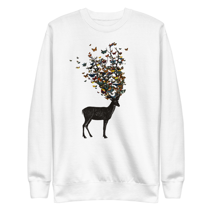 The image depicts a dark, silhouetted deer standing on a neutral background. Instead of branches, its antlers transform into a swirling cloud of vibrant, colorful butterflies that extend upwards and outward. The mix of organic and ethereal elements creates a captivating and whimsical visual contrast.