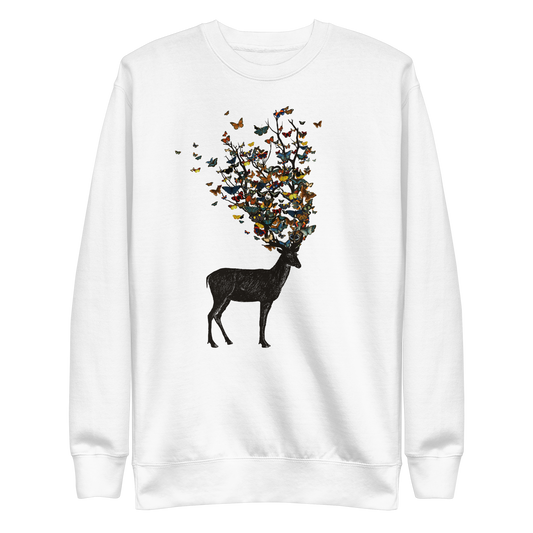 The image depicts a dark, silhouetted deer standing on a neutral background. Instead of branches, its antlers transform into a swirling cloud of vibrant, colorful butterflies that extend upwards and outward. The mix of organic and ethereal elements creates a captivating and whimsical visual contrast.