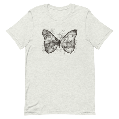 The image features a black and white butterfly where the wings are created using ancient world map designs. The maps overlay in intricate detail, blending geographical elements with the organic shape of the butterfly. Surrounding the butterfly are faint outlines of text and additional geographic features, creating a vintage and exploratory vibe.
