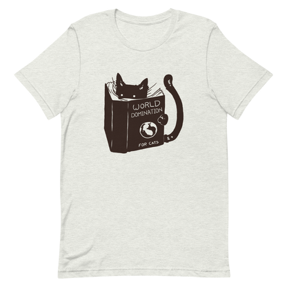 The design features a black silhouette of a cat peeking from behind an oversized book. The book's cover reads 'World Domination for Cats,' and includes a simple drawing of a globe. The cat's eyes are wide open, suggesting either surprise or intense focus on its 'world domination' plans.