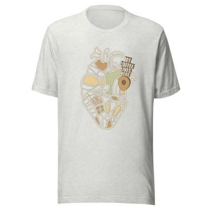 An anatomical heart illustrated like a map, marked with a small coffee-bean pin beside the phrase “My Coffee Lives Here”. A symbolic and cozy design that blends warmth and creativity, perfect for coffee lovers who treat their favorite brew as the fuel that keeps their heart beating.