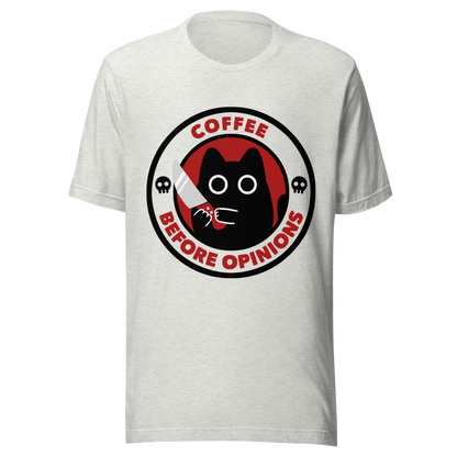 The illustration, in shades of red and black, features a wide-eyed black kitten holding a knife at the centre. Surrounding the cat is the phrase ‘Coffee Before Opinions’. A fun and cheeky gift for those who love cats and can’t function without their coffee.